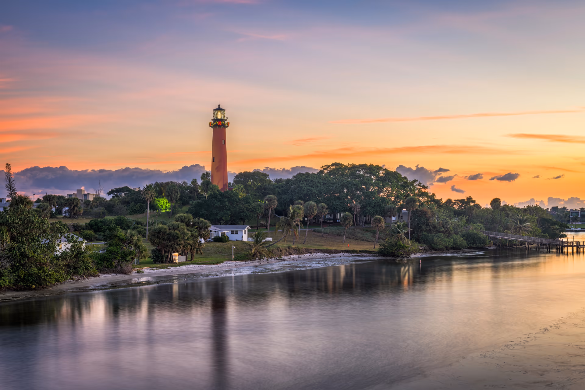 Jupiter Inlet Lighthouse at sunset overlooking the Loxahatchee River and Jupiter Inlet in Palm Beach County, Florida